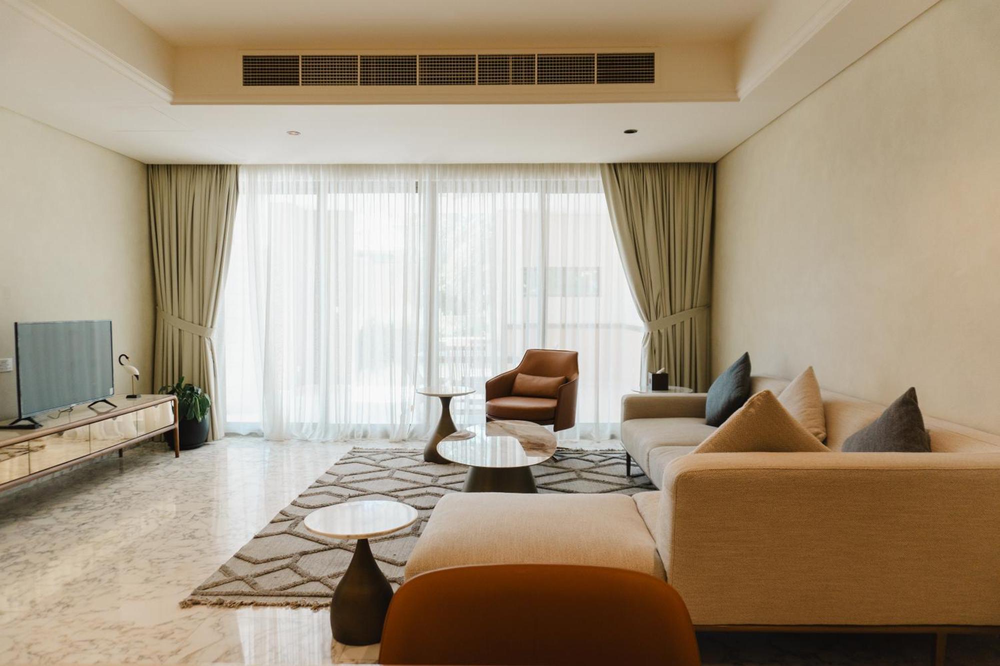 Palavra Resort Manama Dış mekan fotoğraf A living room in a condominium